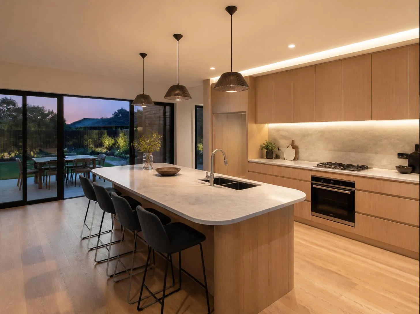 Finished kitchen renovation with bright benchtops and clean cabinetry